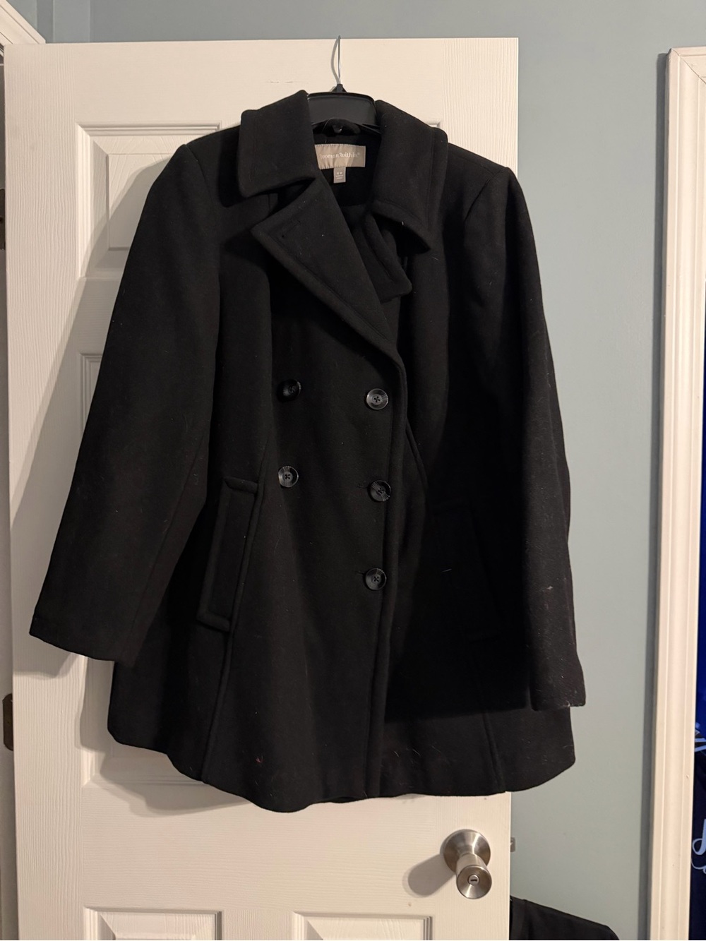 Woman Within Black Double-Breasted Peacoat